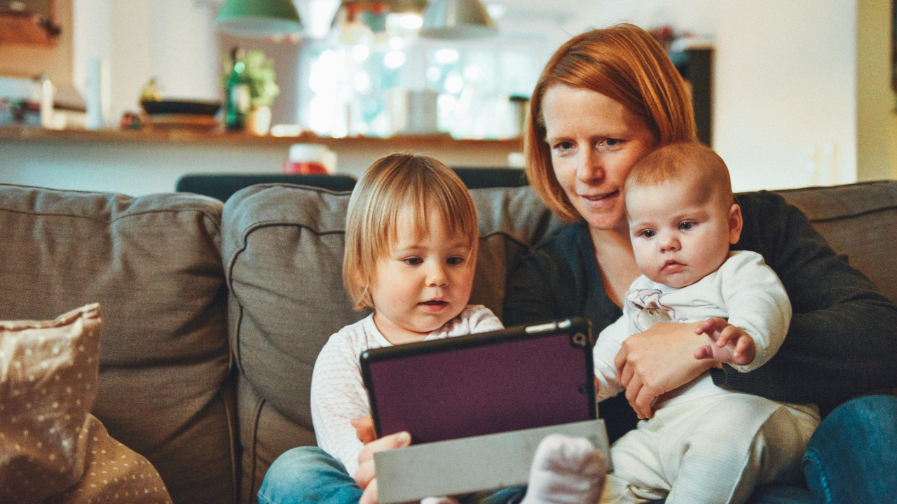 mom reading to her children during her daily routine