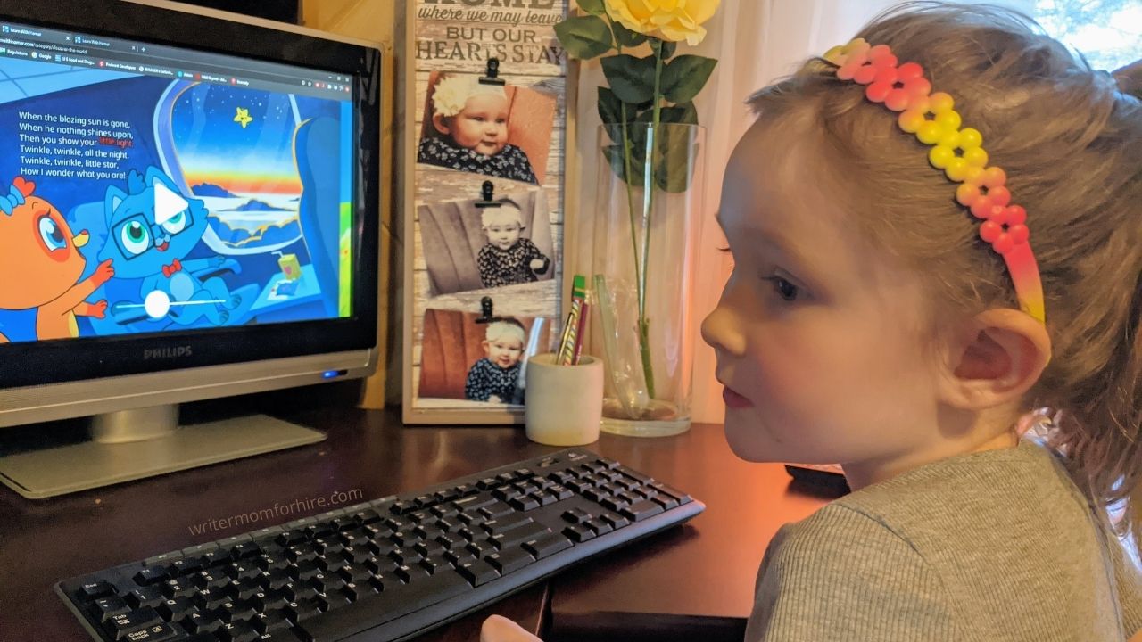 my daughter using the homer reading app on the computer