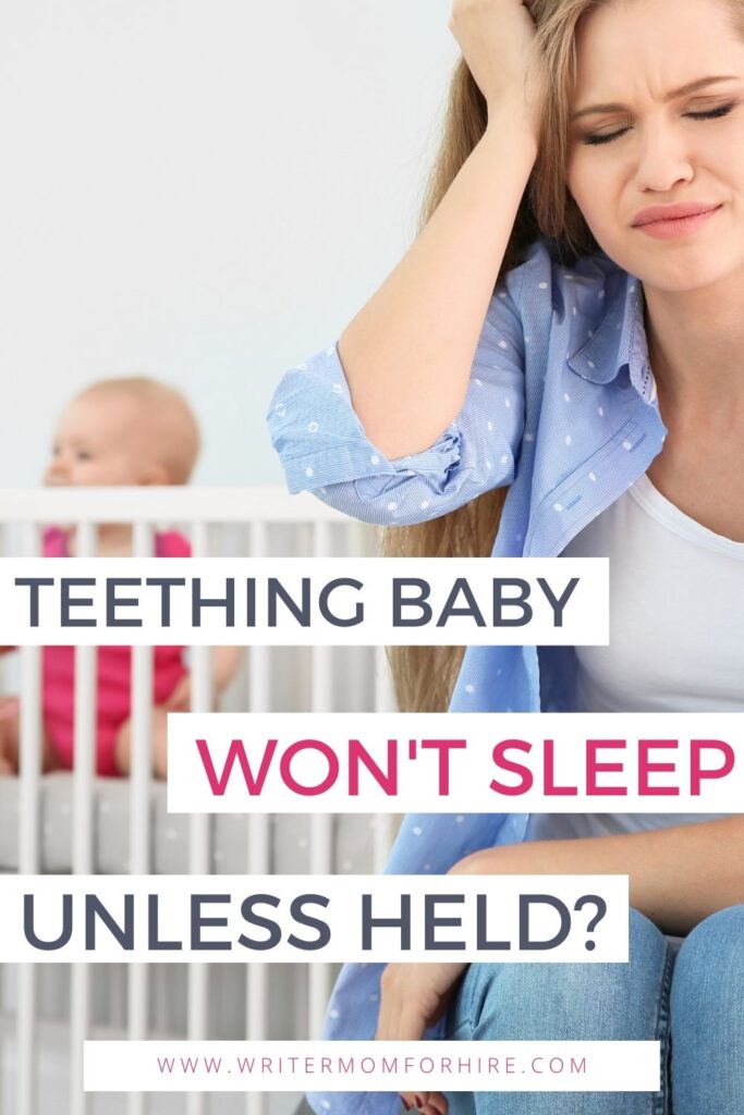 tired mom next to crib with baby sitting upright; text that reads: teething baby won't sleep unless held?