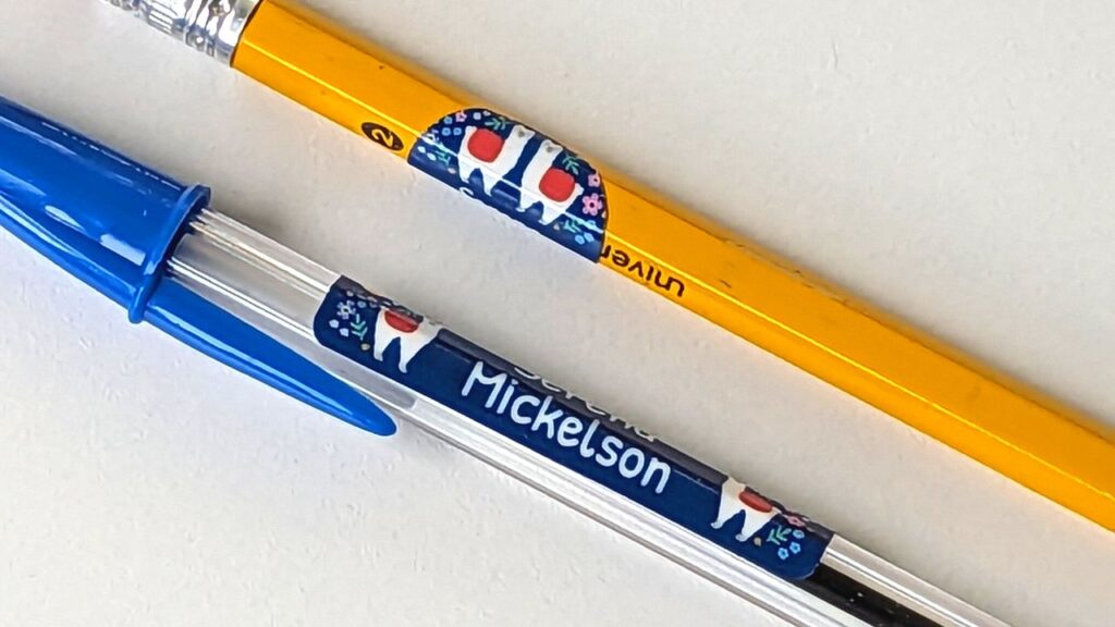 pen and pencil with llama name bubbles labels on them