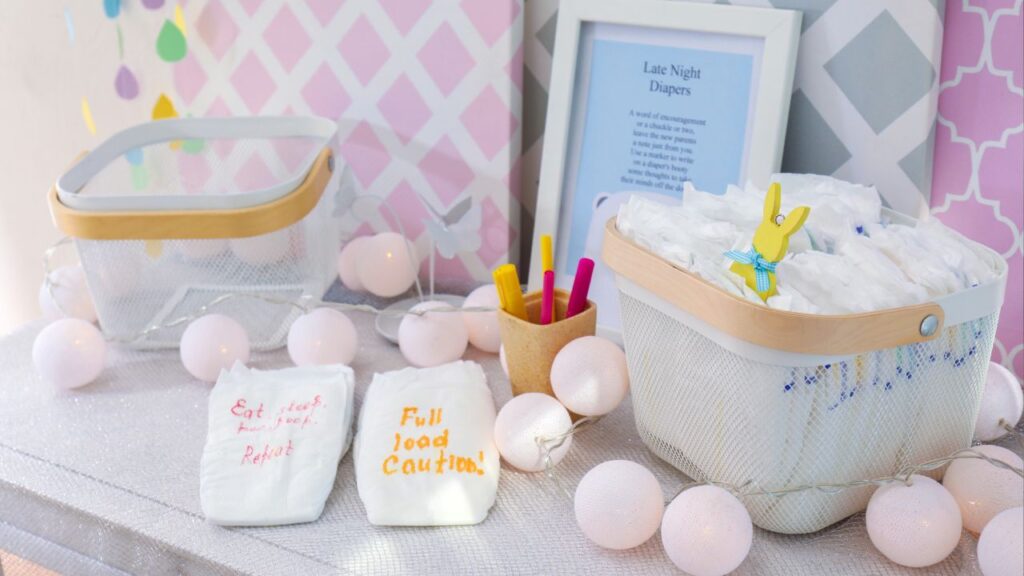 baby shower game with diapers on a table with funny messages written on them
